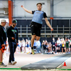 Liam Collins leaps high into the air at the University of North Dakota Fritz Pollard Athletic Center in Grand Forks for an East Grand Forks-hosted indoor track and field meet on April 19. Collins won the long jump and finished second in the triple jump. (photo by Bruce Brierley)