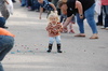 Carrying a hand full of candy already, Danika Quamme attempts to pick up more candy off the street during the Badger Fall Fest Parade on September 16. The annual celebration officially ran September 14-17. (photo by Ryan Bergeron)