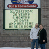 Al and Val Truscinski stand in front of the sign commemorating their years of ownership to River’s Edge Bait and Convenience on January 29, 2024— their final day of ownership. The couple sold the business to Dhaval (David) Divyesh, Dipen, and Amit Patel. (submitted photo)