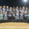 The Gator Softball team members pose with their Agassiz Valley Conference Championship medals following their 10-1 win over the Thief River Falls Prowlers under the lights at the Gator Softball Complex in Greenbush on May 19. The team earned the top overall seed in the Section 8A Softball Tournament, finishing the regular season 20-1, and would open the postseason at home on May 23. Pictured are (L-R): Front: Audrey Gust, Jaci Hanson, Elizabeth Gust, Tessany Blazek, Cassie Dahl, Kinsley Hanson, Jordan Lee, and Meagan Otto; Back: Kailey Hanson, Kenzie Dahl, Sierra Westberg, Quinn Vacura, Sarah Pulk, Zairyn Wimpfheimer, Teagan Landsrud, Kayle Vacura, Maelee Christianson, Kieran Nelson, Jocelyn Waage, and Savannah Anderson. (photo by Ryan Bergeron)