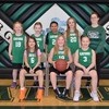 The Third Grade Gator Girls Basketball team poses together. They are (L to R): Front Row: Janiya Jenson, Brielle Byre, and Parker Stoppelman; Back Row: Ella Hanson, Giuliana Sovde, Aliyah Kern, Kilah Sather, and Coach Mercedes Snare. (photo by Erin Przekwas)