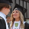 Badger High School graduate Raegen Maahs looks up at her classmate and fellow graduate Elliott Isane, sharing a brief moment after the receiving line finished following the One-Hundred-Fifth Annual Commencement Exercises at Badger School on May 21—a day that saw 13 students graduate. (photo by Ryan Bergeron)