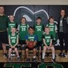 The Third Grade Gator Boys Basketball team poses together. They are (L to R): Front Row: Bayze Line, Mark Maashio, and Joseph Ryden; Back row (L to R): Coach Chase Grinsteiner, Tate Grinsteiner, Axel Stenberg, Kyler Samson, Elliot Mather, and Coach Anne Stenberg. (photo by Erin Przekwas)
