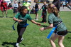 GMR second graders Aliyah Kern and Kilah Sather attempt to take each other’s flags as the final two GMR second grade students remaining in the girls’ flag tag event, as part of Gator Day on May 19. (photo by Ryan Bergeron)