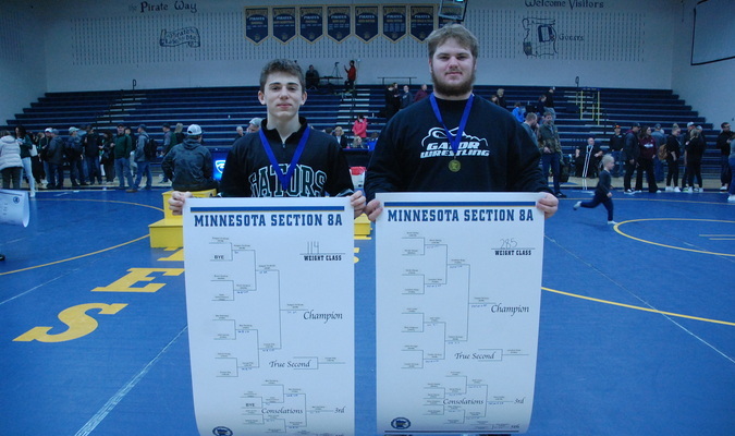 Freshman Keegan VonEnde (114) and Treston Nichols (285) hold up their Section 8A championship brackets while sporting their section championship medals following action from the Section 8A Wrestling Tournament at Crookston High School on February 24. With their championship wins, both advance to their first career state tournaments, joining teammate Sarah Pulk (Girls 155), who qualified for state two weeks prior. VonEnde and Nichols open action on Friday, March 1 and Pulk on Saturday, March 2 from the Xcel Energy Center in St. Paul. (photo by Ryan Bergeron)
