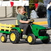 Aiden Bauman drives this miniature tractor through the Badger Fall Fest Parade on September 16, 2023, as part of the Lil Chomper’s Child Care parade entry. (photo by Ryan Bergeron)