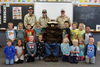 On Thursday, September 28, SMOKEY the Bear and his ranger friends visited the Badger kindergarten classroom. SMOKEY teaches how to prevent human-caused wildfires and how to protect animal habitats. SMOKEY and the rangers helped the kindergarten class put on a skit teaching the correct way to enjoy a campfire and how to make sure it is completely out before leaving one’s campsite. Each student received a bag of learning resources to reinforce this classroom message. Pictured are (L-R): Front: Ayven Blazek, Ghazi Jean, Jack Berger, Brynlee Moore, SMOKEY the Bear, Taylor Randall, Lucas Erickson, Crystal Mekovich, and Colt Langaas; Middle: Evan Haugen, Ivy Seydel, Gary Erickson, Charlotte Daignault, James Evans, Julius Jenson, Deklyn Madoll, and Aron Wyatt; Back: Rangers. (submitted photo)