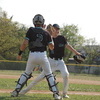 Gator starting pitcher Elliott Isane (right) gives a high five to the glove of his catcher Taylor Davy after striking out two straight batters to help preserve the Gators’ 3-2 lead going into the bottom of the third inning. The Gators eventually lost 6-4 to the Norman County East/Ulen-Hitterdal Titans on May 25—the team’s home and regular season finale. Isane took the loss, giving up five runs, three earned, on five hits and three walks, and striking out seven over six plus innings. (photo by Ryan Bergeron)