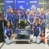 The Gator Robotics team poses with its trophies and robot in its pit area after finishing second at the Great Northern Regional from the Alerus Center in Grand Forks, officially held March 6-9. As the eighth-ranked alliance, the team lost its opening playoff match before winning four straight elimination matches to advance to the finals. Pictured are (L-R): Front: Delilah Nuriddinova and Brylie Kjersten; Back: Francis Cudnik, Carissa Prevost, Sawyer Strand, Quinn Pittman, Vincent Stenberg, Berlyn Burkel, Katelyn Waage, Andrew Glad, Jalyssa Gust, and Brooklyn Wahl. (photo by Ryan Bergeron)
