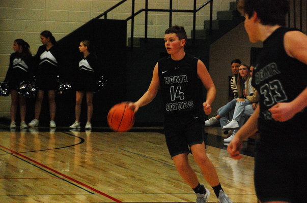 Masen Swenson dribbles the ball down the court during the Gator Boys Basketball team’s 61-58 home loss to the Blackduck Drakes back on January 12, 2023. (photo by Ryan Bergeron)