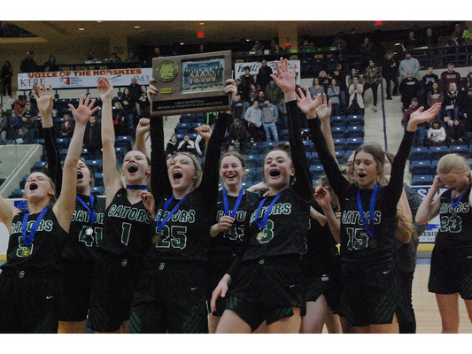 The Gator Girls Basketball team celebrates with its fans while hoisting its Section 8A Championship trophy following its 53-50 victory over the Fosston Greyhounds at the Ralph Engelstad Arena in Thief River Falls back on March 10, 2023. (photo by Ryan Bergeron)